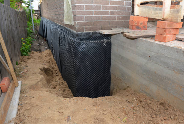 SJ Waterproofing Pros technician performing targeted Wet Basement Repair assessment in Springfield, TN